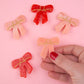 red and pink bow hair clips